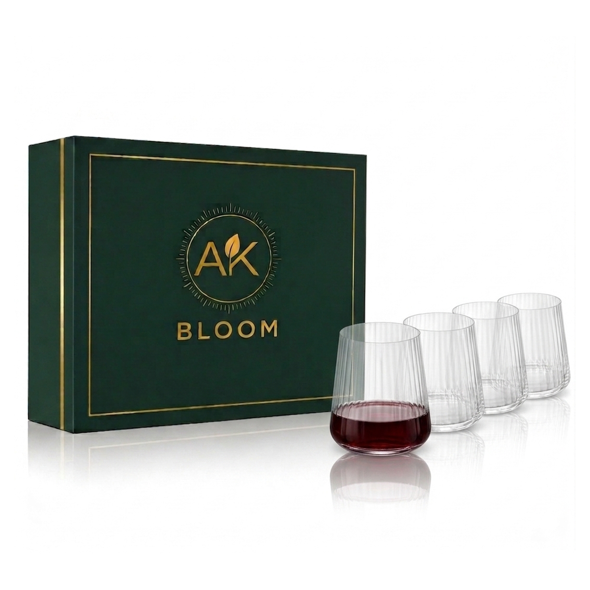 AK BLOOM set of 4 clear ribbed crystal tumblers, 300ml each, one partially filled with red wine, displayed beside a dark green gift box with gold trim.