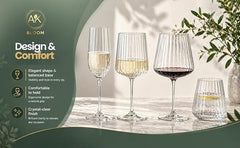 AK BLOOM ribbed glassware collection featuring champagne flute, wine glasses and tumbler with elegant balanced design