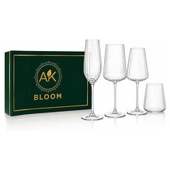 AK BLOOM mixed ribbed crystal glassware set featuring four clear glasses, displayed beside a dark green and gold gift box on a white background.